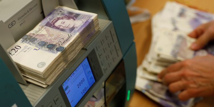 Sterling holds gains on eve of UK inflation data, US rate decision