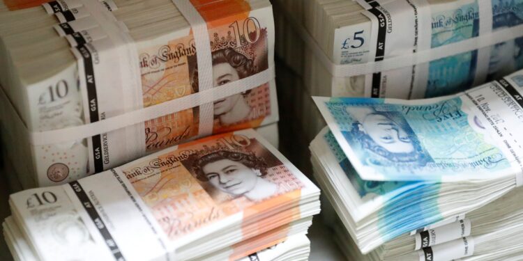 Sterling slips against dollar as focus turns to UK budget