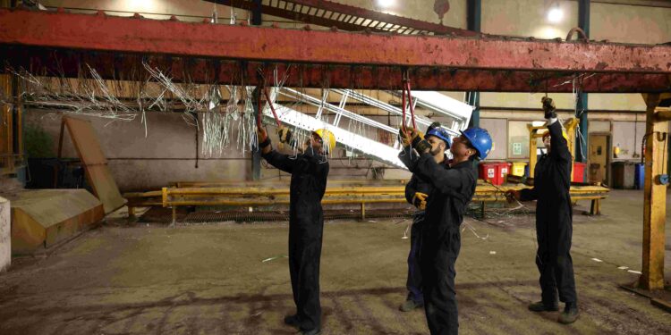 UK factory activity shrinks slightly for first time since April, PMI shows