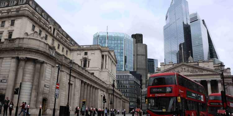 UK firms lost momentum and cut staff after budget, surveys show