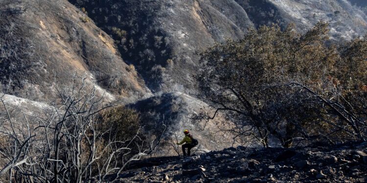 Los Angeles races to contain wildfires before severe winds return
