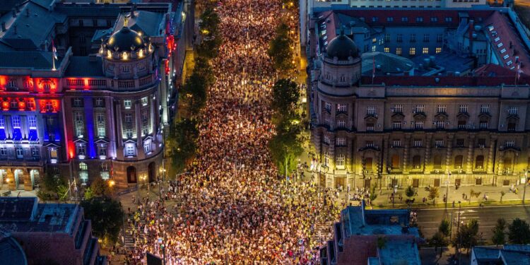 Tens of thousands march in Serbia’s capital, demand snap vote
