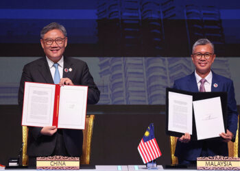 China and ASEAN, hit by US tariffs, sign upgraded free trade pact