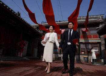 In China, wedding bells are ringing in nightclubs, a subway station and on snowy mountain peaks