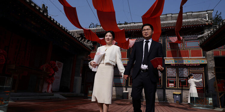 In China, wedding bells are ringing in nightclubs, a subway station and on snowy mountain peaks