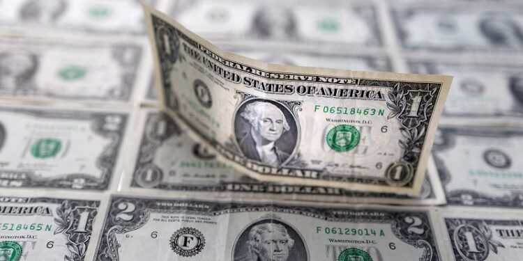 Dollar hovers near five-week low on Fed rate cut bets