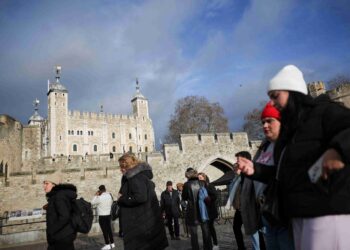 Four arrested at Tower of London after apple crumble and custard thrown at State Crown display