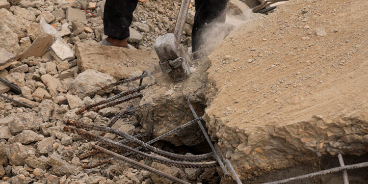Desperate Gazans pull iron bars from rubble to construct tents and scratch out a living