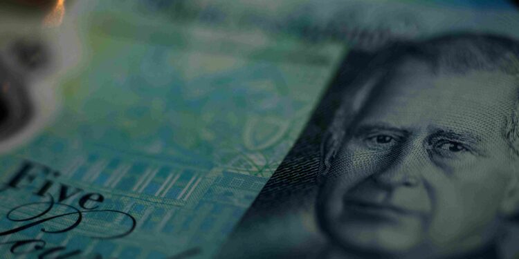 Sterling holds onto gains on dollar, awaits data