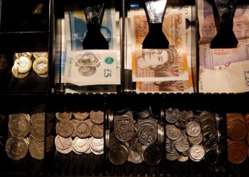 Sterling edges lower after data shows surprise drop in UK GDP