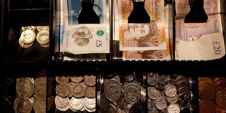 Sterling edges lower after data shows surprise drop in UK GDP