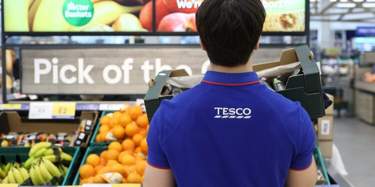 Britain’s Tesco boosts hourly pay to 13.28 pounds