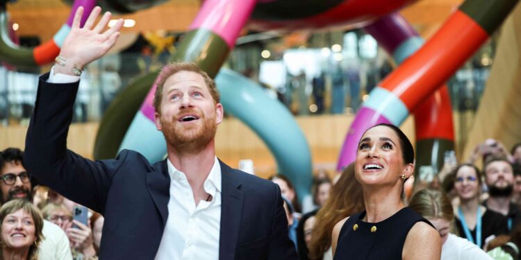 Prince Harry and Meghan arrive in Australia to a muted welcome