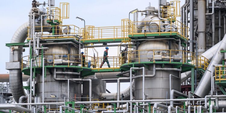 German industry keeps cutting jobs despite first sales rise in three years, EY says