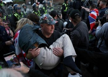 British PM urges calm after protests over handcuffed student’s death