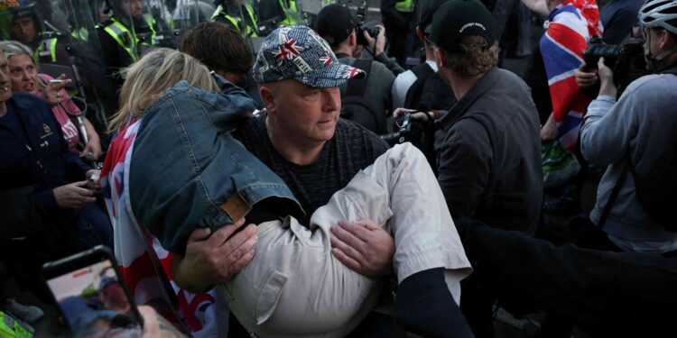 British PM urges calm after protests over handcuffed student’s death