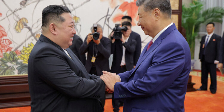 Flags, gun salute greet China’s Xi on arrival in North Korea for summit