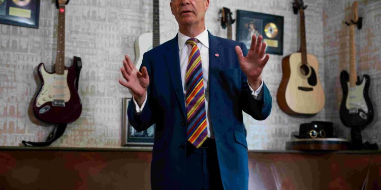Bank of England warns of scams after fake video shows brawl with Reform UK’s Farage