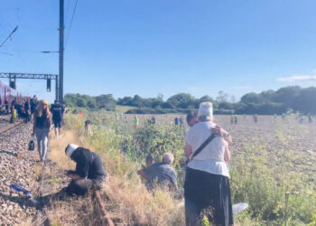 One killed and dozens injured in train collision north of London