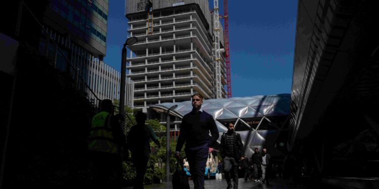 UK jobs market downturn eases as pay pressure pick up, survey shows