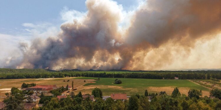 Wildfire rages near Paris as heatwave scorches Europe