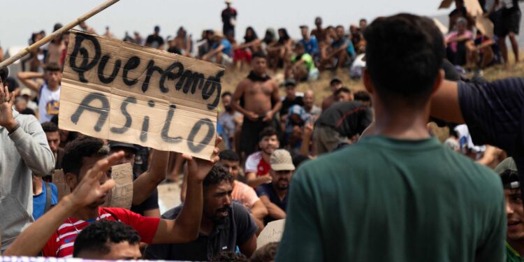In Spain’s Ceuta, hundreds of migrants stage protest and demand asylum