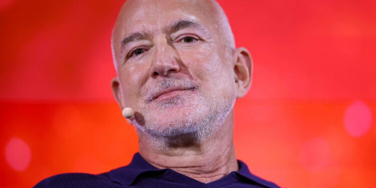 Soccer-Amazon founder Bezos nears deal to buy stake in Liverpool, reports say