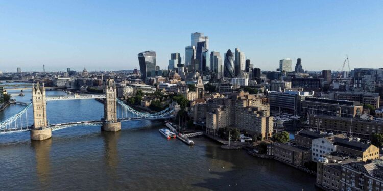 UK economy gathers pace but cost pressures intensify, PMI shows