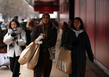 UK shoppers stay cautious as fuel costs bite, surveys show